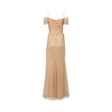 Fiordelli Donna champagne gold evening gown with off-the-shoulder draped sleeves, thin spaghetti straps, and a shimmering sequin mesh texture on a white background.