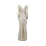 A floor-length champagne gold sequin evening gown by Fiordelli Donna featuring a V-neckline, long sleeves with puffed shoulders, and a high side slit on a white background.