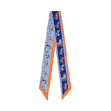 Flat view of the Muni Women’s Blue/Orange Multicolor Printed Twilly Scarf, a refined printed accessory. Available Online