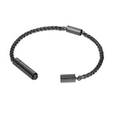 Focused studio shot of the integrated matte black stainless steel fold-over security clasp on the Cerruti 1881 chain bracelet.