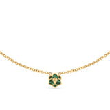 A symmetrical front-facing studio view of the Saint Honoré Burj small flower pendant necklace on a clean white background, showcasing the green malachite inlays and the center gold SH monogram.