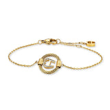 A high-resolution studio shot of the Aigner Cirena women's luxury bracelet, showcasing its radiant yellow gold-plated stainless steel chain construction, the central polished 'A' horseshoe monogram emblem, and the delicate adjustable clasp system completed with an engraved Aigner logo charm.