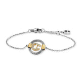 A high-resolution studio shot of the Aigner Cirena women's luxury bracelet displayed against a white background, highlighting its silver-tone chain and central twisted wire cable ring, which houses a gold-plated 'A' horseshoe emblem set with small clear crystals, alongside its lobster clasp and extension chain finished with a signature logo charm.