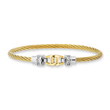 A high-resolution studio shot of the Aigner Ale Tre women's luxury large bangle displayed horizontally against a white background, highlighting its twisted yellow gold-plated stainless steel cable band, the central polished gold horseshoe-style connector element, and the silver-tone cap connectors encrusted with a vertical row of small clear crystals.