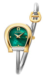 A direct studio front catalog portrait of the women's Aigner Flora S watch, highlighting its two-tone gold and silver horseshoe case, textured checkered emerald green Mother of Pearl dial, and the wrapping tubular steel bangle with its contrast yellow gold horseshoe logo charm.