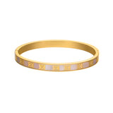 A front studio product photograph of the Escada Eliza gold-plated bangle bracelet, showcasing the inlaid iridescent pink Mother of Pearl band accented with a repeating series of yellow gold Escada monogram logos.