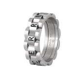 Front angle view of the silver stainless steel Cerruti 1881 Paolo men's band ring, showing its textured knurled layers and central logo plaque.