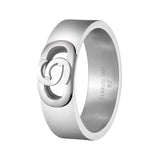 Front angle view of the silver stainless steel Cerruti 1881 Paolo men's band ring, showing its textured knurled layers and central logo plaque.