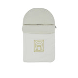 Front closed view of the Aigner kids newborn White baby nest with gold logo frame and monogram hood Available for Online Purchase