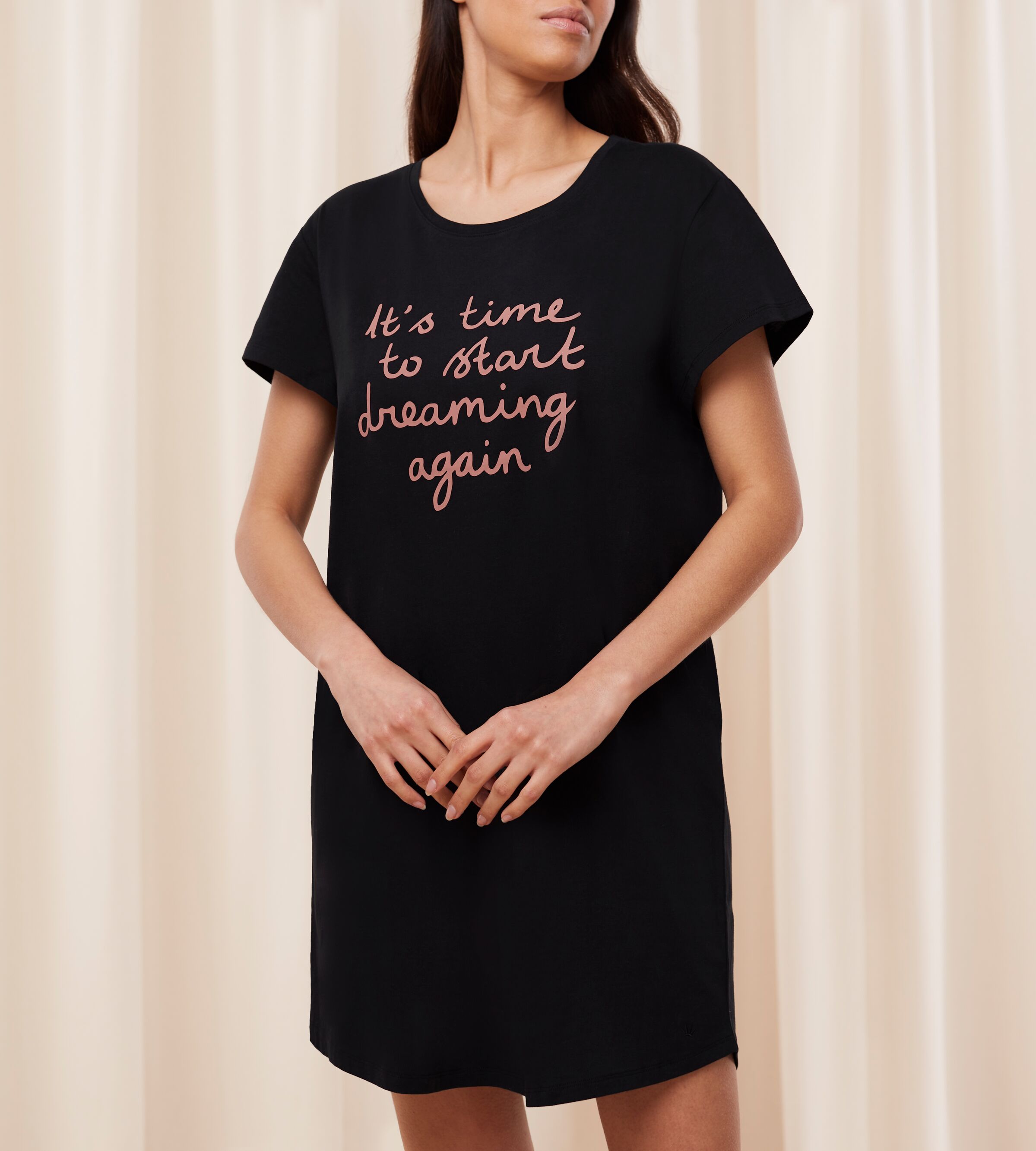 Front view of Model wearing the Triumph black short sleeve nightdress, showing the relaxed silhouette and soft-touch fabric. Available for Online Purchase