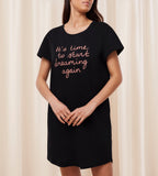 Front view of Model wearing the Triumph black short sleeve nightdress, showing the relaxed silhouette and soft-touch fabric. Available for Online Purchase