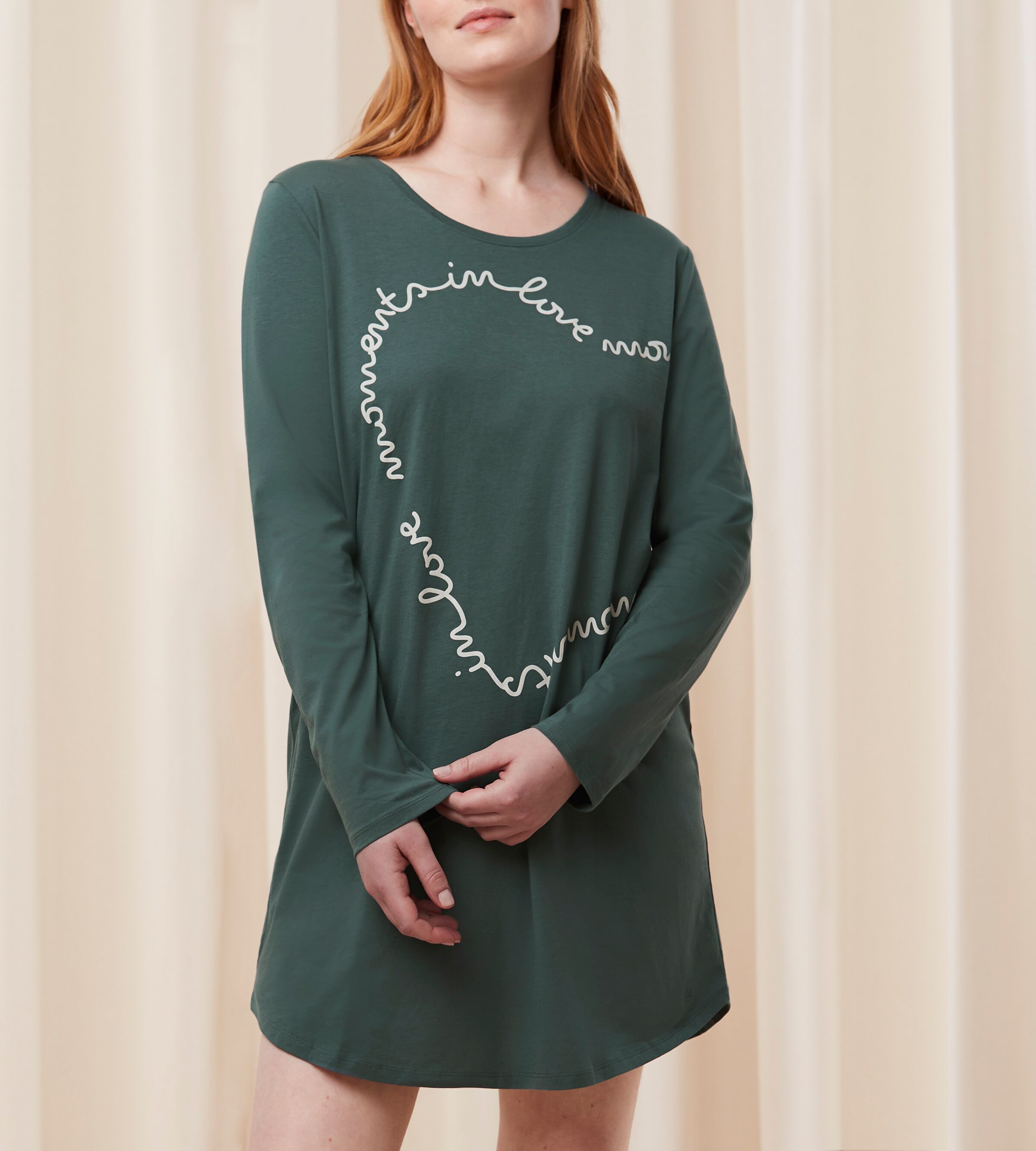 Front view of Model wearing the Triumph green long sleeve nightdress, highlighting the soft ribbed texture and relaxed straight-cut fit. Available Online