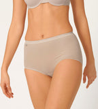 Front view of model wearing the Sloggi Basic+ beige maxi panties, showcasing the high-waisted silhouette and soft cotton texture. Shop Now Online