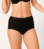 Front view of model wearing the Sloggi Basic+ black maxi panties, showing the full-coverage cut and soft cotton texture. Available Online Today