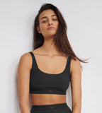 Front view of model wearing the Sloggi Ever Ease black bra top, showing the wide shoulder straps and seamless, wire-free design. Available Now Online