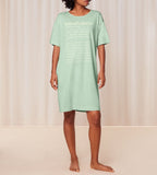 Front view of model wearing the Triumph green short sleeve nightdress, highlighting the relaxed silhouette and soft-touch fabric. Shop the Latest Online