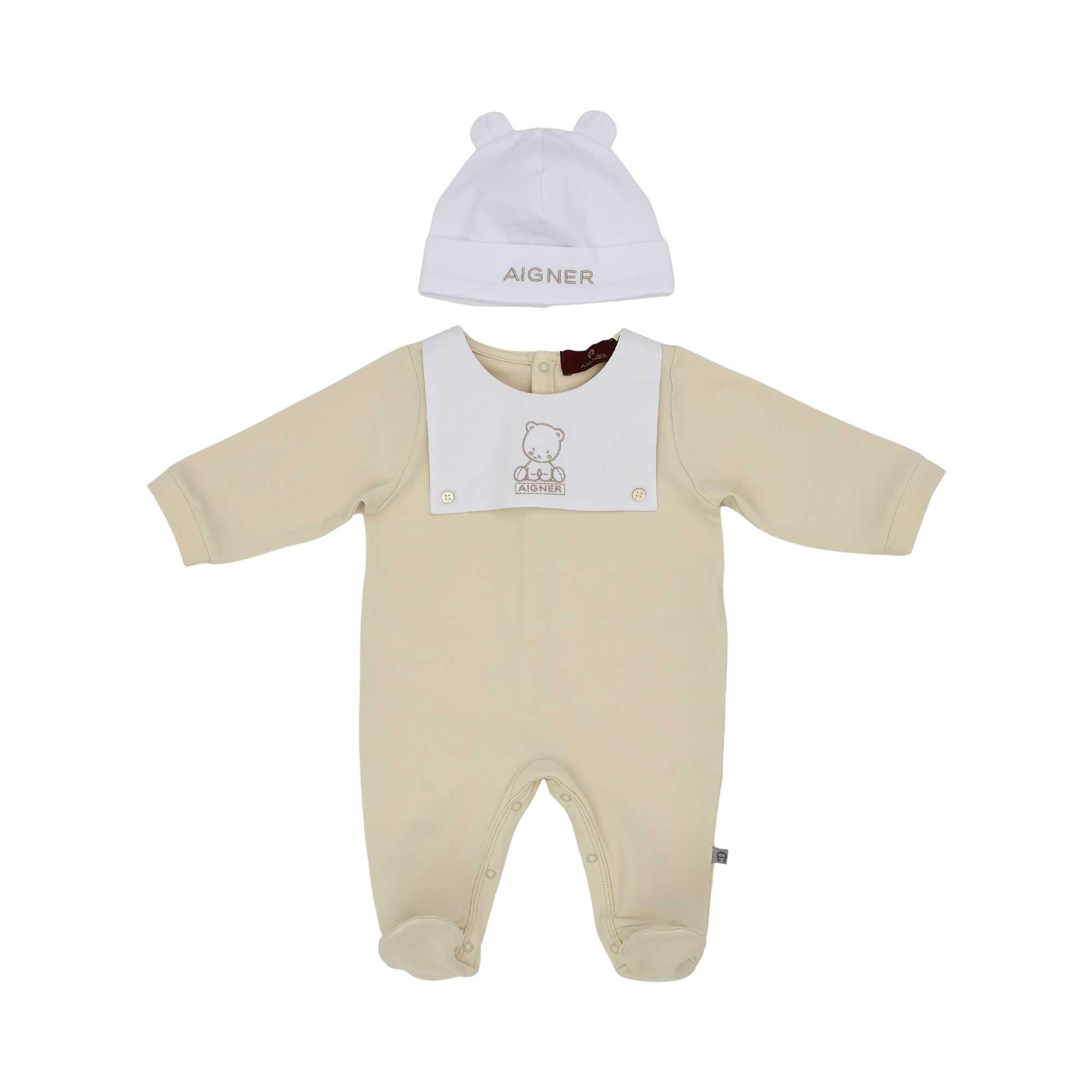Front view of the Aigner kids newborn beige sleepsuit set with teddy embroidery and ear hat. Find Online Today