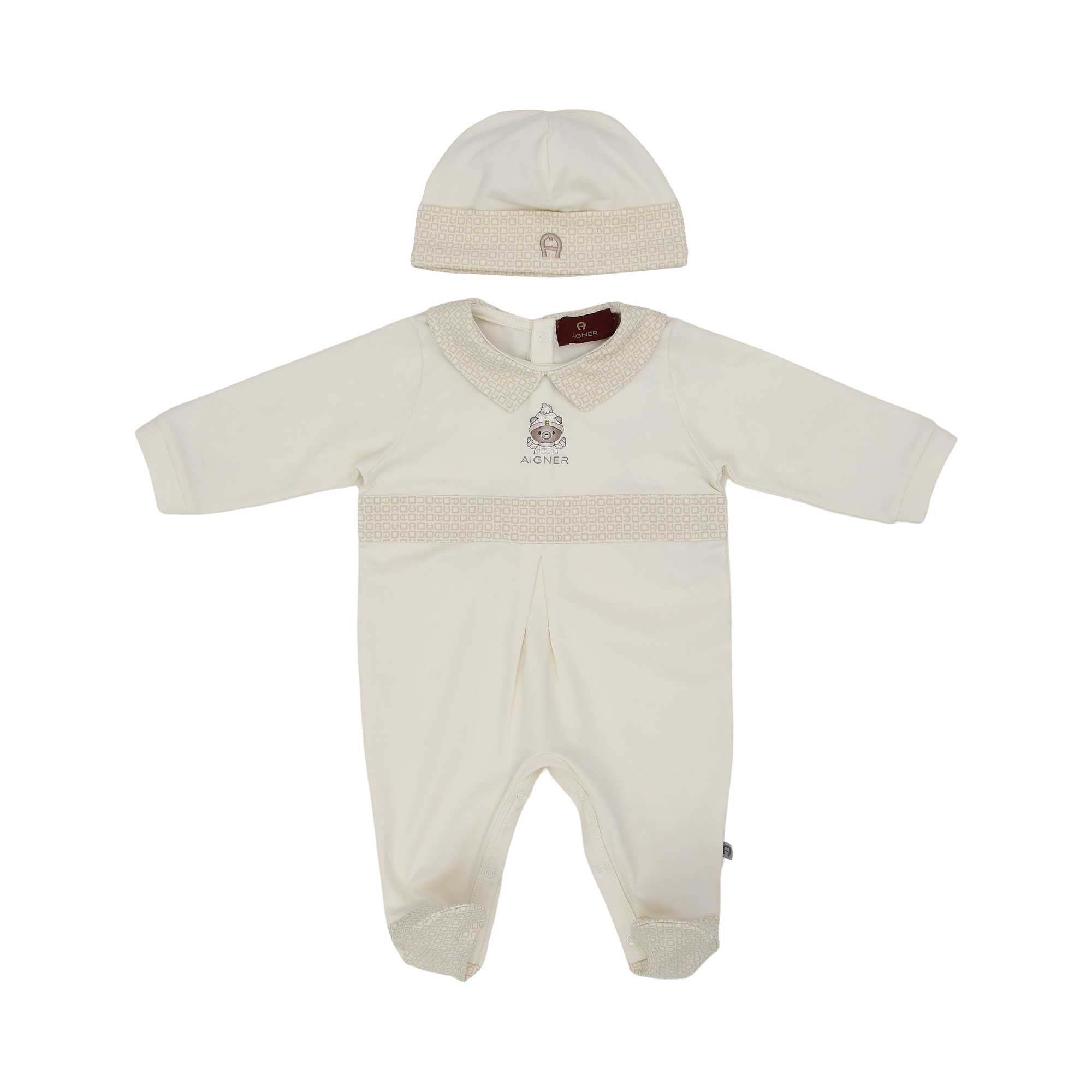 Front view of the Aigner newborn beige sleepsuit with monogram collar teddy motif and matching hat. Available for Online Purchase.