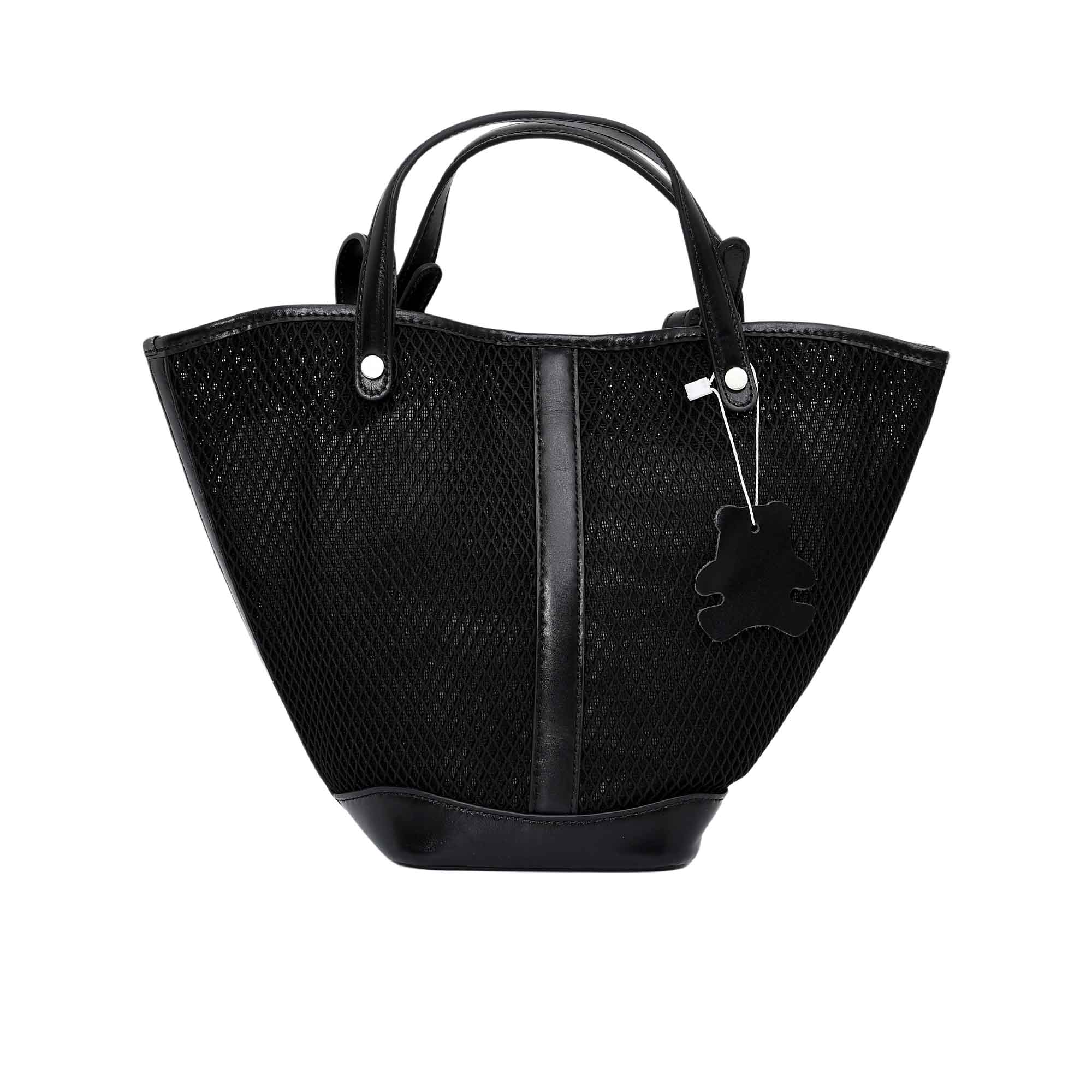 Front view of the Karisma black mesh tote bag, featuring a flared trapezoid shape, smooth vertical leather-style trim, and dual top handles. Available Now Online