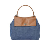 Front view of the Karisma denim shoulder bag with Brown leather trim and top handle. Available for Online Purchase