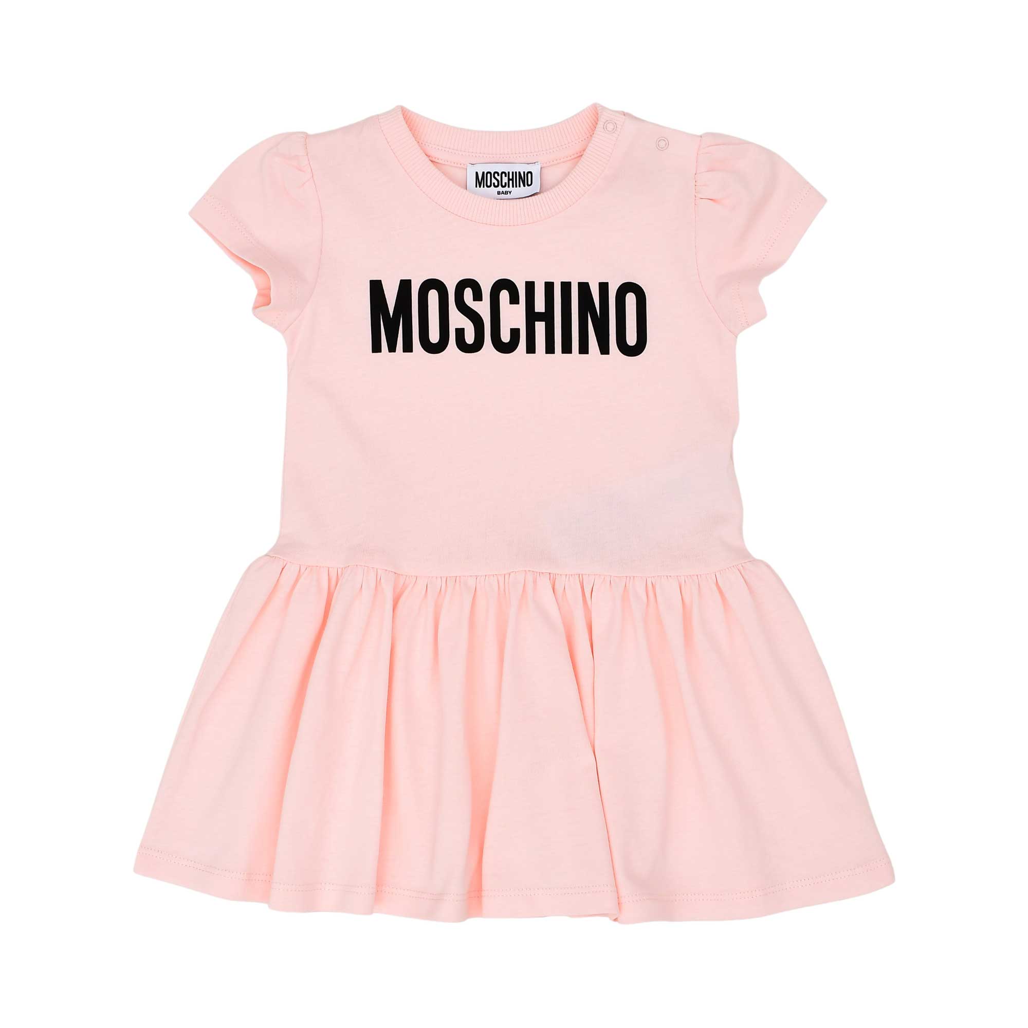 Front view of the Moschino baby girl pink logo dress short sleeve flared hem. Find Online Today