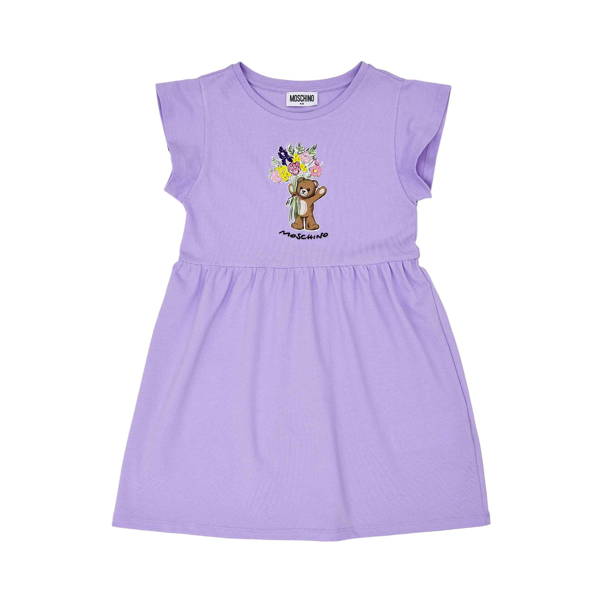 Front view of the Moschino kids girls floral teddy dress in Purple with flared skirt. Available for Online Purchase