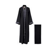 Front view of the Nero women's black embroidered abaya with nay and silver detailing and matching scarf. Shop the Latest Collection