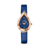 Clean frontal studio view of the Saint Honoré Petit Palais rose gold-plated teardrop watch, highlighting the chevron textured blue dial, diamond-accented lugs, and blue alligator-embossed leather strap.