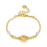 Full front view layout of the gold-plated Cerruti 1881 Celeste bracelet, highlighting the double parallel chains and crystal round central charm.
