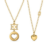 A full studio composition layout of the two complete Escada Mia necklaces, highlighting the relative drop sizes of the heart pendants, the fine cable chain draping, and the individual adjustable clasp tracks.