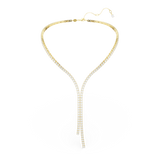 A full overhead studio layout of the Swarovski Matrix Y necklace, demonstrating the complete round contour of the warm gold-plated strand and its dramatic cascading centerpiece.
