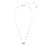 A full overhead studio view of the Swarovski Una Angelic necklace, showcasing the entire length of the fine rhodium-plated link chain and the delicate drop of the green clover pendant.