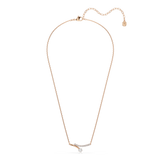 A full overhead studio view of the Swarovski Matrix necklace, demonstrating the complete length of the fine 18K rose gold-plated chain and the delicate drape of the asymmetric centerpiece.
