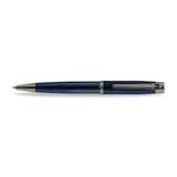 A high-resolution studio presentation of the Aigner Albano men's luxury ballpoint pen displayed horizontally against a white background, highlighting its metal barrel finished with a textured, spiral-grooved blue lower grip, a smooth blue upper body, a multi-ringed gunmetal center band, an IP gunmetal pocket clip featuring the horseshoe logo, and the matching gunmetal writing tip cone.