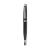 A high-resolution studio presentation of the Aigner Monzio men's luxury ballpoint pen displayed horizontally against a white background, highlighting its brass barrel finished in a textured, brushed matte black pattern, a central gunmetal band, a sleek metallic pocket clip debossed with the Aigner name, and the exposed fine writing tip.