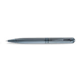 A high-resolution studio shot of the Aigner Ettoro men's luxury ballpoint pen displayed horizontally, highlighting its textured gunmetal-blue and chrome brass barrel, the central engraved Aigner brand band, the integrated pocket clip, and the exposed fine writing tip.