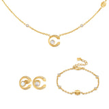 Cerruti 1881 Bella jewelry set showcasing the gold-plated pendant necklace and matching round stud earrings with white mother-of-pearl and crystal detailing.