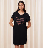 Full front view of Model wearing the Triumph black short sleeve nightdress, showing the relaxed silhouette and soft-touch fabric. Available for Online Purchase
