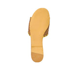 Bottom view of a GAIA flat sandal showing the smooth tan leather sole and heel tap from BLUE SALON.