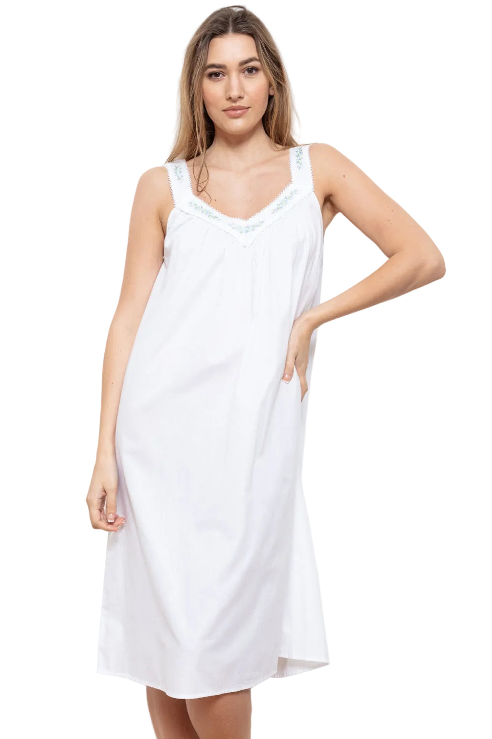 White sleeveless nightdress with wide straps and light blue floral embroidery on the V-neckline and straps.