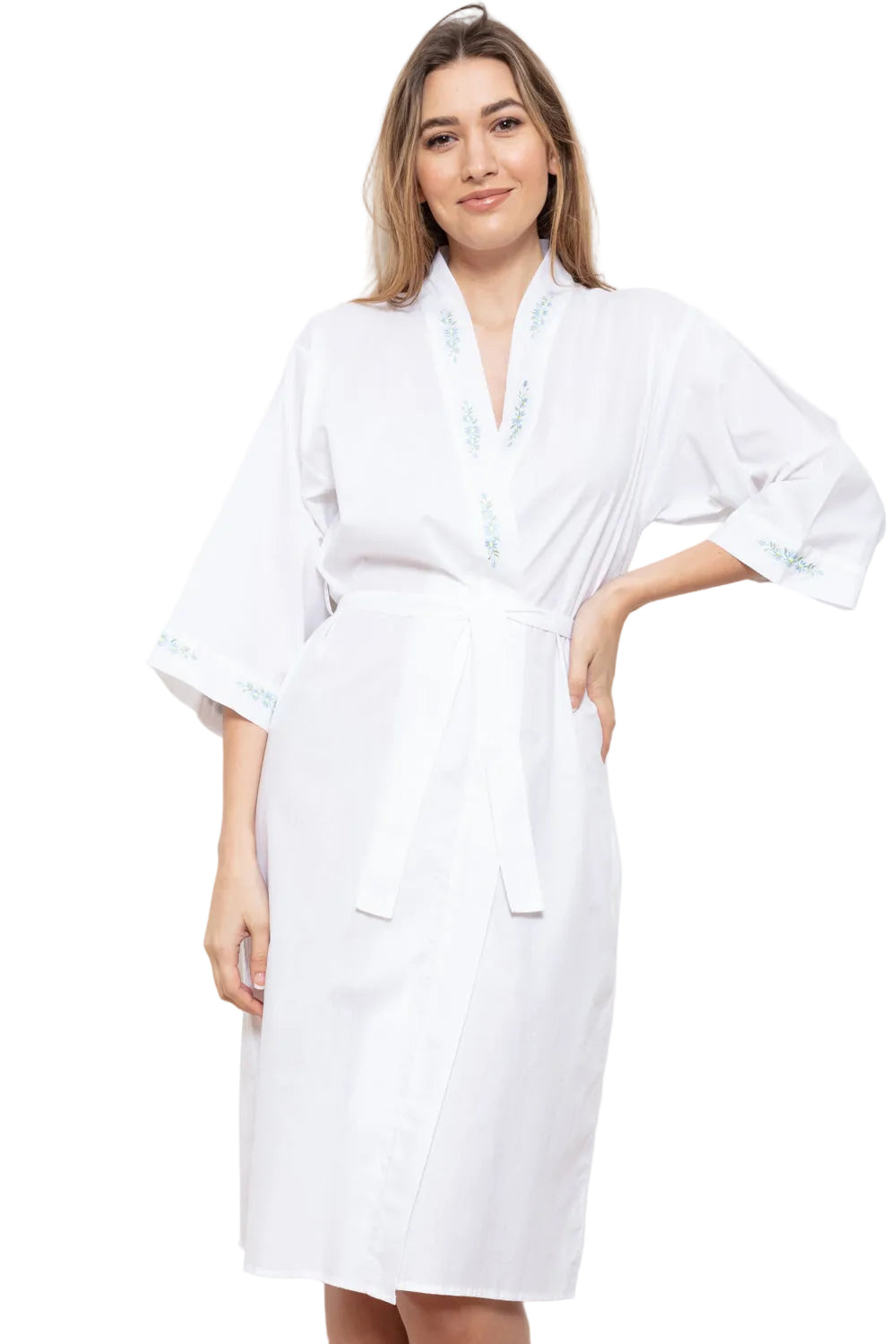 White wrapover kimono robe with light blue daisy embroidery on the V-neckline and three-quarter sleeves.