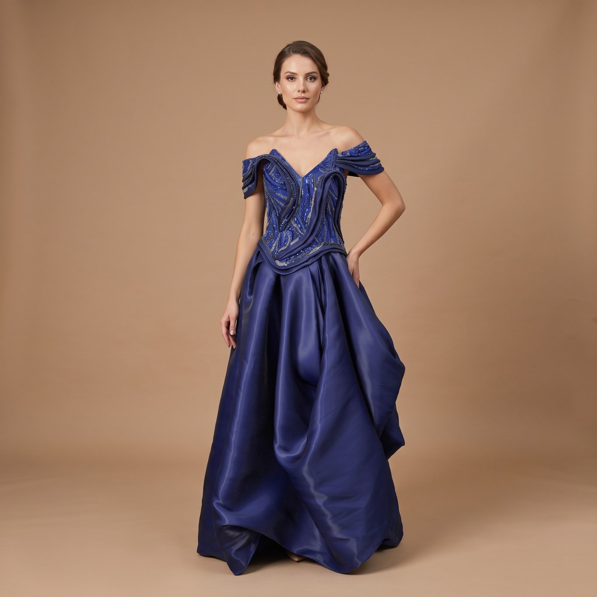 Dress blue off-the-shoulder gown with a V-neck, fitted bodice featuring intricate blue and silver-toned beadwork, and a volum