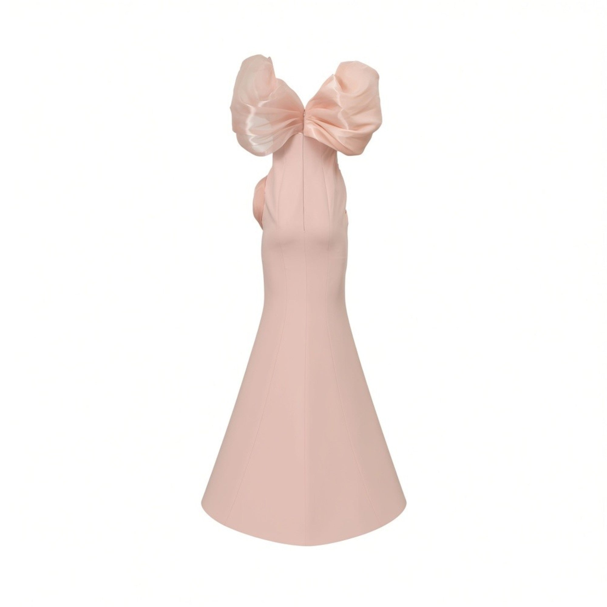 Light pink sleeveless dress with a fitted bodice and flared skirt. Features a large, sheer pink bow at the back of the neck.