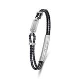 Silver-toned bracelet with two braided black and grey leather strands. Features a rectangular plate with a geometric pattern