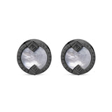 Two circular cufflinks, each with a dark gunmetal-toned metal frame and a central white mother-of-pearl inlay.