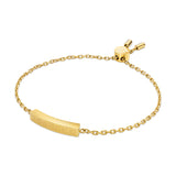 Gold-toned delicate chain bracelet with a central curved bar featuring a Greek key pattern and an adjustable slider closure.