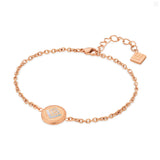 Rose-gold-toned chain bracelet with a circular medallion featuring a crystal 'G' on mother-of-pearl, bordered by a Greek key