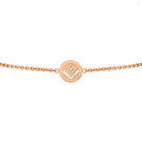 Rose-gold-toned bracelet with a circular medallion featuring a Greek key border and a 'G' design of crystals and mother-of-pe