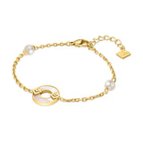 Gold-toned chain bracelet with a white mother-of-pearl ring charm featuring two gold-toned stylized G-logos, and two white pe