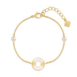 Gold-toned chain bracelet with two white pearls and a central white mother-of-pearl ring with gold-toned geometric logos.